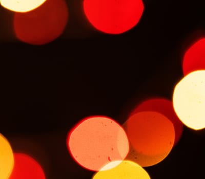 Red and yellow bokeh pattern on a dark background wallpaper